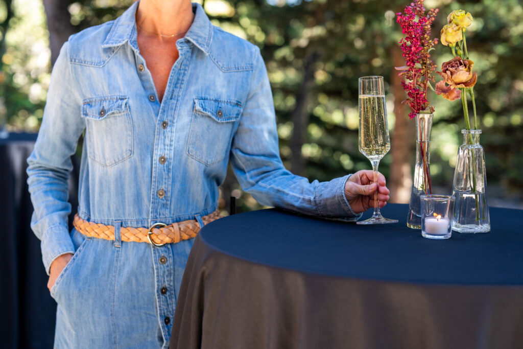 A lady sitting in a chair in a blue room