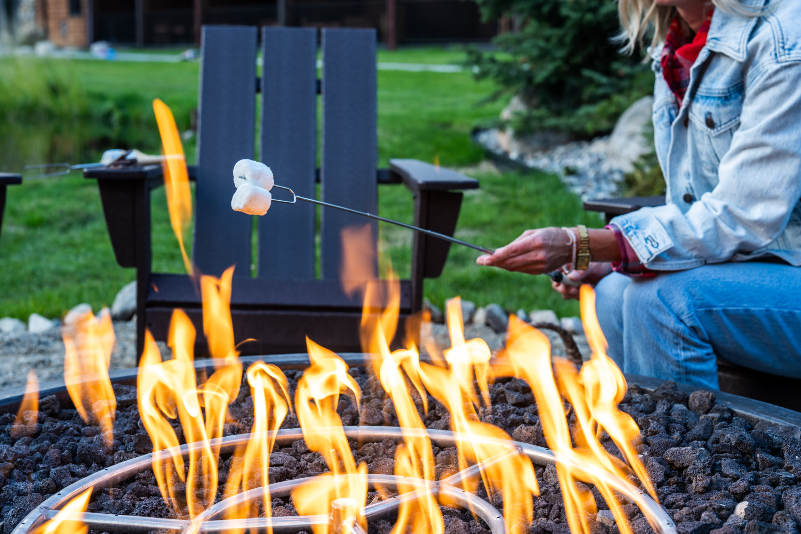 A lady roasting marshmallows