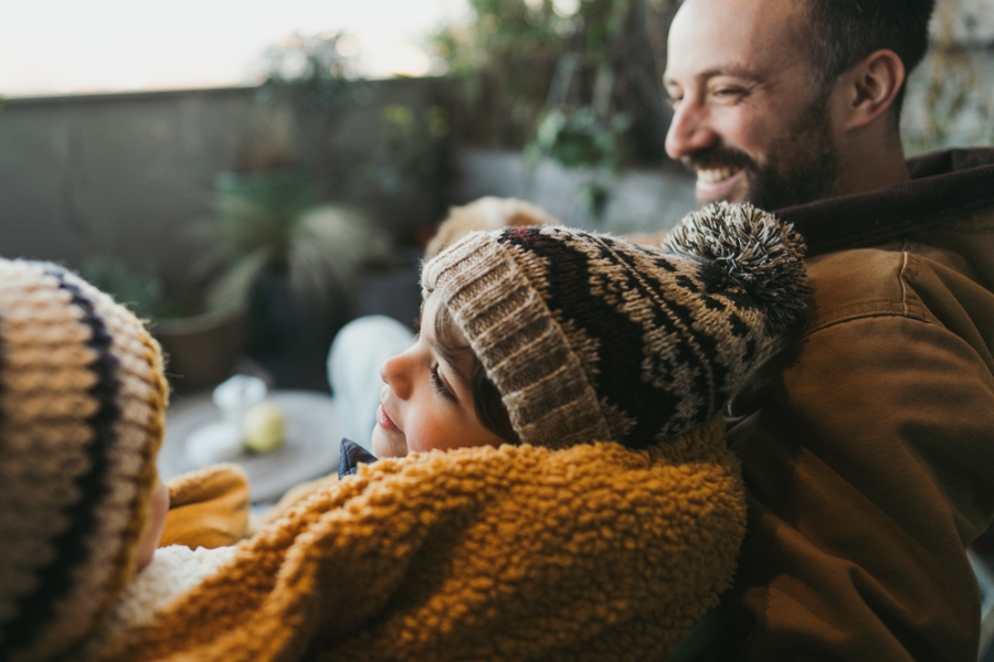 a family sitting together outside